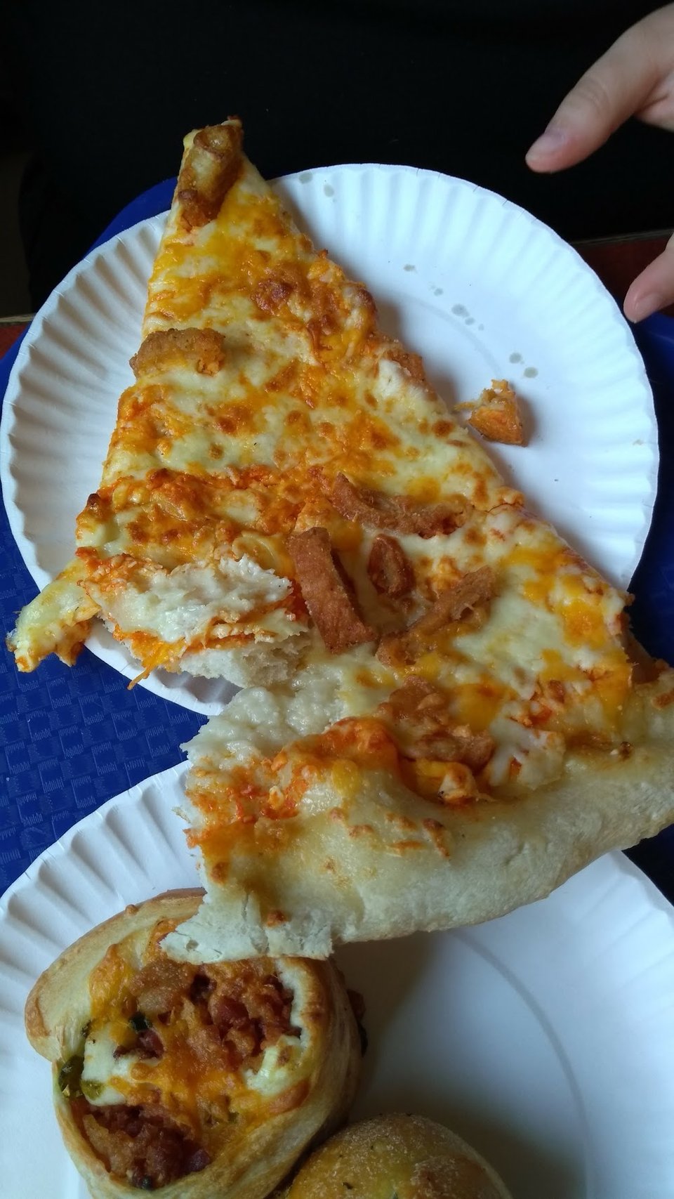 Pizza restaurant menu beside cold beverages